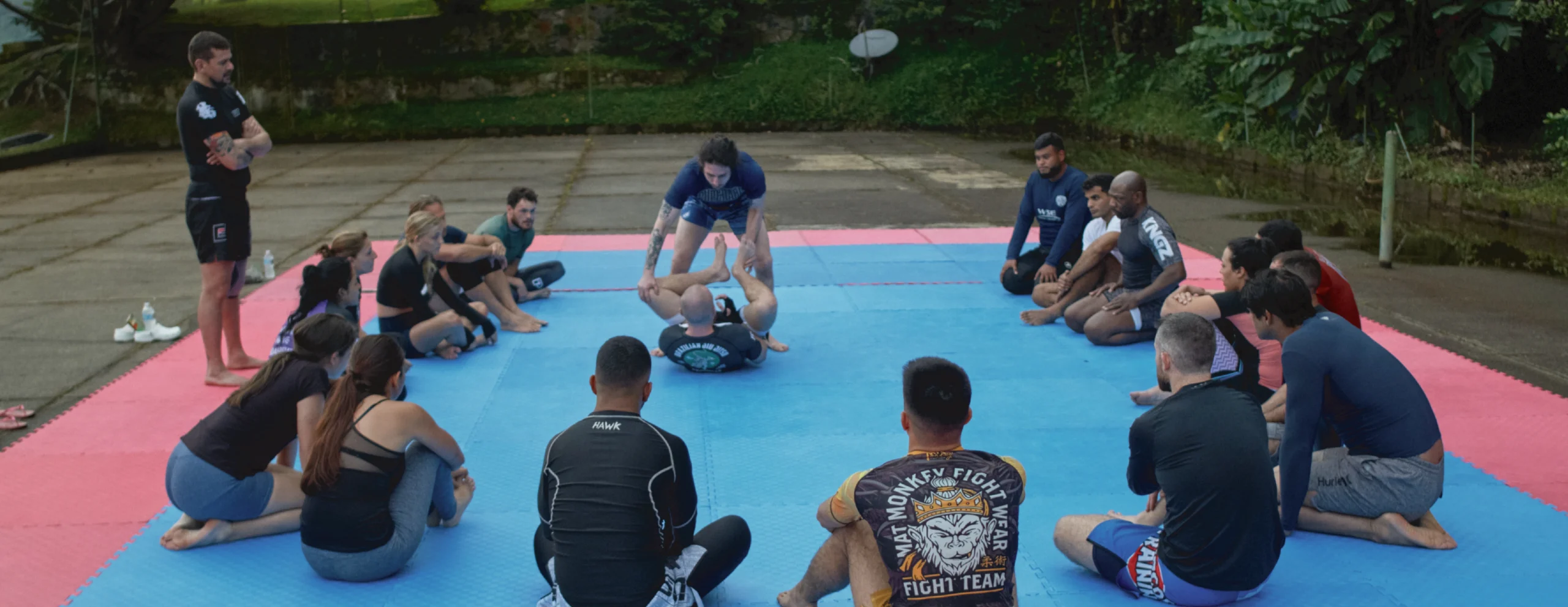 Campers at BJJ Camp XP watch a technique demonstration by one of our BJJ Camp XP pros.