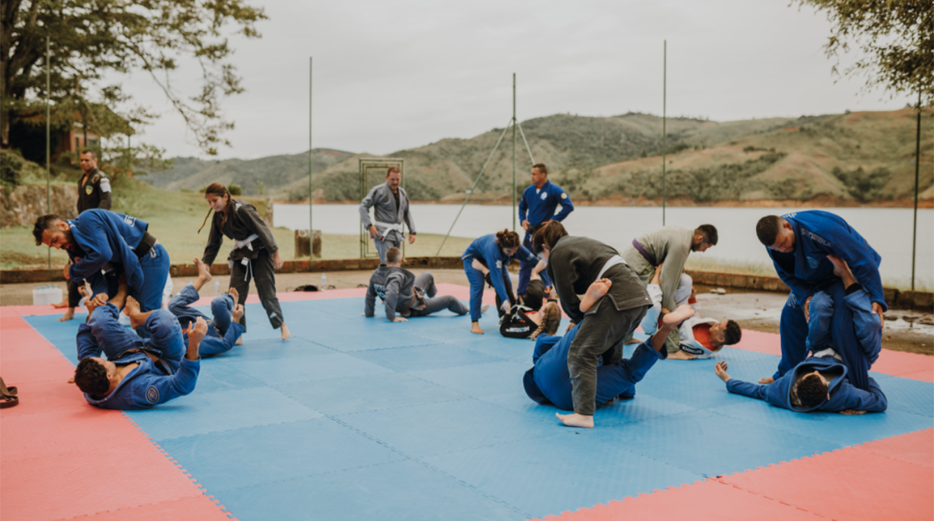 BJJ Camp XP participants practicing various techniques on the mats, showcasing the intensive training sessions and camaraderie in the beautiful outdoor setting of Calima, Colombia.