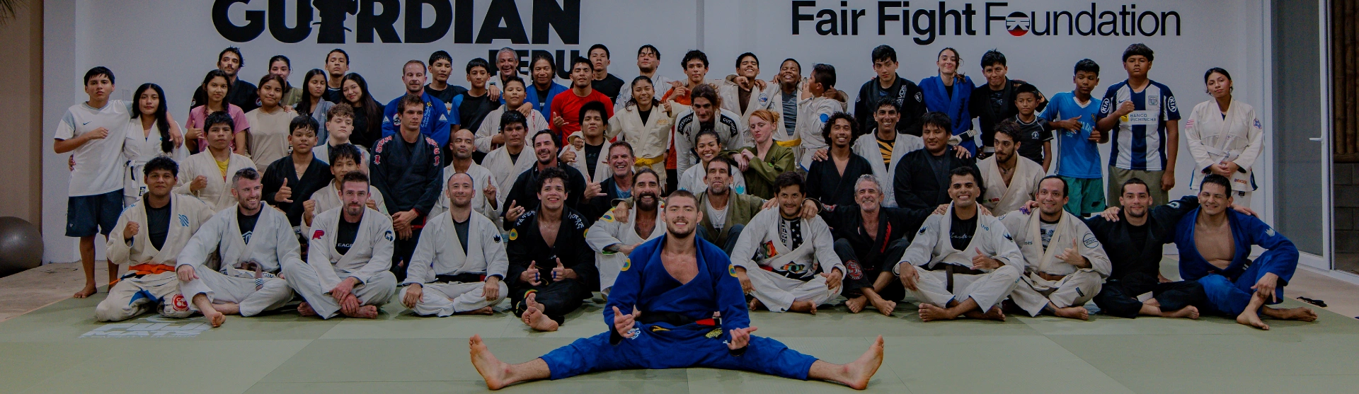 Group photo of athletes and local community during a Brazilian Jiu Jitsu Camp in Peru training event.