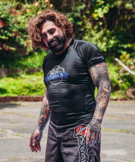 Athlete wearing black rashguard during outdoor training at a Brazilian Jiu Jitsu Camp in Peru.