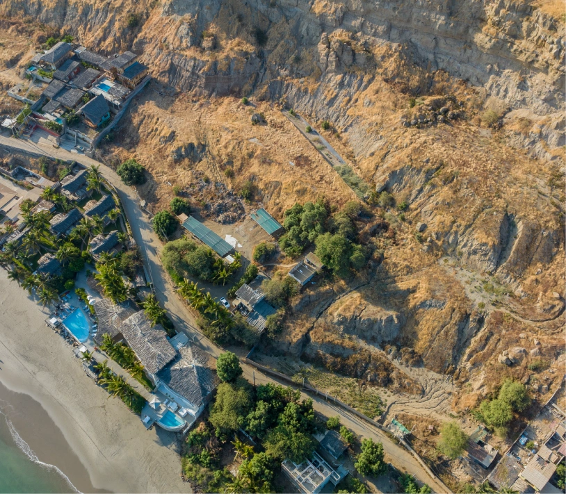 Aerial view of oceanfront villas and coastline in Peru, location of a Brazilian Jiu Jitsu Camp in Peru.