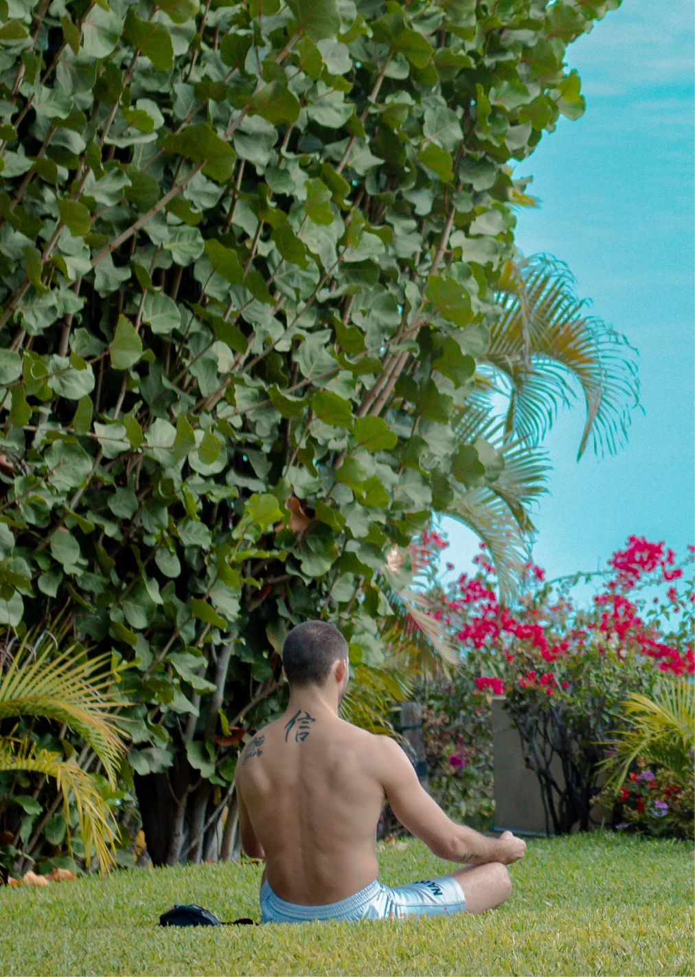 Athlete meditating outdoors during a recovery session.